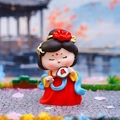 Q-version Tang Dynasty lady figurine holding a red flower fan in a mini garden scene - Holding Fan Style / [product Attributes]: Visually This Is A Q-version Tang Dynasty-style Lady Doll Figurine. The Product Features A Vibrant Hanfu (traditional Han Clothing) In Red Yellow And Blue With A Large Red Flower In Her Hair. She Holds A Round Fan Adorned With Red Flowers Her Eyes Closed In A Lifelike Pose. The Material Appears To Be High-quality Resin Or Pvc. [visual Presentation]: The Image Uses A Detailed Realistic Photographic Style. The Background Is A Miniature Chinese Garden Scene Including Ancient Architecture And Flowers Highly Consistent With The Product's Cultural Theme. Image Quality Is [high] With Excellent Clarity And Natural Lighting. Aesthetic Appeal Is [high] With An Overall Score Of [8.8]. The Overall Color Scheme Is Harmonious And Possesses A Strong Oriental Charm. [text Content]: No Overlaid Text Brand Logos Or Watermarks Were Detected In The Image. [logistics Labels]: None. This Product Is A Common Handicraft Figurine And Does Not Belong To Sensitive Categories Such As Those Containing Electricity Or Liquids. [infringement Risk]: None. The Product's Design Is In A General Cultural Style And No Specific Brand Logos Or Copyrighted Ip Images Were Found In The Background Or Props. 【product Parameters】: Apart From The Visually Visible Q Version Design And Classic Hanfu Color Scheme No Specific Size Or Weight Data Was Found.