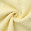 Close-up of yellow breathable double gauze cotton fabric with soft muslin texture - S / 100% Cotton Style / Yellow