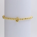 Polished golden beaded bracelet featuring a minimalist 3D letter J pendant charm - Gold J