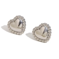 Polished silver heart stud earrings with beaded frame detail and minimalist style - Twisted Edge Heart Stud Earrings / Steel
