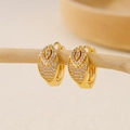 Detail of gold huggie earrings with double-layered pavé cubic zirconia on a wooden display - EH412015 Double Layer Teardrop