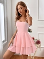 Detail of pink cotton A-line dress featuring double-layered ruffle hem and waist bow tie - XS / Pink