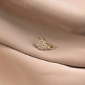 Elegant gold flower non-piercing nose clip with sparkling zircon stones on beige fabric - Crystal Flower (E5525)