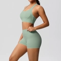 Detail of sage green yoga set showing moisture-wicking fabric and high-waist fit - S / Basil Green