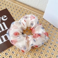 Beige sheer floral scrunchie with red and blue polka dots on a woven rattan mat - Red Double Layer Mesh