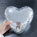 Silver heart shaped disco ball with reflective mirror tiles held in hand for party decor - 20cm / Silver