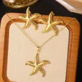 Golden starfish jewelry set with necklace and stud earrings on woven display board - Starfish Artificial Pearl Jewelry (FYD6205+FYD6205XL)