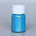 Fine blue pearl powder for DIY slime and resin art in a transparent round plastic bottle - Pearl Powder #12 Gold Blue
