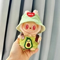 Plush monster doll wearing green corduroy overalls with avocado embroidery and matching hat - Avocado Overalls Two-piece Set + Green Heart Hat / First And Second Generation Keychains Are Compatible With La Cloth Dolls. Dolls Not Included.