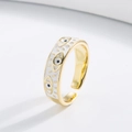 Close-up of gold evil eye open ring with white enamel detail and adjustable band structure - Adjustable Open / Gold/White
