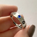Adjustable S925 silver ring featuring blue gemstone and black enamel flower detail - Adjustable Open / Blue