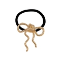 Gothic style black elastic hair tie with a textured gold metal bow accessory - Gold Line Spiral