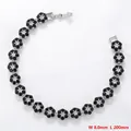 Detail view of flower link bracelet with black and white zircon stones and 8mm width text - Platinum Black Zirconia Bracelet (VL527)