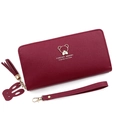 Deep red long zipper wallet in pebble leather with wristlet and rabbit charm - Red