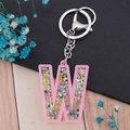 Pink acrylic letter W keychain with colorful star sequins and silver metal clasp - Letter W