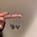 Detail shot of silver heart-shaped drop earrings held by hand showing scale and shine - Silver Heart Stud (6#)