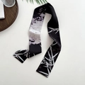 Narrow silk scarf with black and white bamboo leaf pattern flat lay on white surface - Black Bamboo Forest
