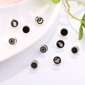 Set of 10 black pearl buttons with swan and floral patterns in a ceramic dish - Swan Mixed Style