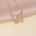 Detailed view of a gold butterfly necklace with clear wings on beige satin background - 3# White Necklace