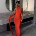 Detail of a sexy orange backless halter dress with long ribbons in a modern setting - XS / Orange Red