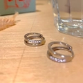 Detailed view of silver double-layered hoop earrings encrusted with white cubic zirconia - Silver