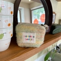 Mini pochette trucco in peluche colorata con cerniera per riporre rossetti e cosmetici - Peluche Arcobaleno Giallo