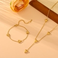 Golden heart-shaped stainless steel necklace and bracelet set on an elegant beige background - Gold Necklace & Bracelet Set (N608+O206)