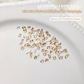 Champagne mini flatback nail crystals in mixed 100-piece pack with various unique shapes - Approx. 100 Pcs / Gold Base Champagne