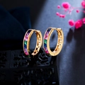 Macro detail of rainbow zircon square-cut stones on gold-plated hoop earrings - Deep Multi-color