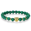 Beaded bracelet featuring green malachite stones and a gold owl head charm - Malachite Bracelet