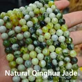 Detailed view of natural Qinghua jade round beads featuring unique black and white patterns - Natural Blue Flower Jade 4mm (Approx. 90pcs) Strand