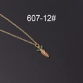Gold carrot pendant necklace with pink and green zircon stones on a gray surface - Pink Green Carrot Style (607-12#)