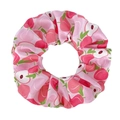 Detailed view of pink satin scrunchie with peach pattern and soft fabric folds - Peach Pink