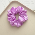 Chic light purple satin silk scrunchie hair tie with elegant glossy fabric texture - Pink Purple