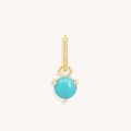 Detail of a gold-plated stainless steel earring featuring a round turquoise stone pendant - December Gold