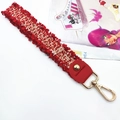Detail of red tweed woven strap with gold lobster clasp and fringed edge texture - Standard Type / Red