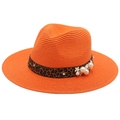 Close-up of orange straw fedora hat featuring leopard ribbon with pearls and flowers - Orange