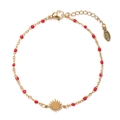 Detail of gold stainless steel bracelet with red beads and a sun pendant charm - Red