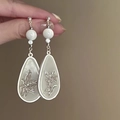 Close-up of silver flower tassel earrings with pearls held by hand for detail - 13# Silver Earring Post - Silver White Lily Drop