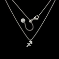 Silver Sagittarius zodiac necklace with pavé crystal pendant on a sleek black background - Sagittarius / Silver