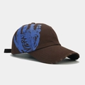 Detail of distressed brim and blue VIBRATE graffiti print on a brown cotton baseball cap - Adjustable / Dark Brown