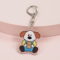 Porte-clés mignon en acrylique avec petit chien en t-shirt jaune et salopette - Chien Tenant un Ours