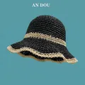 Detail of hand-woven straw hat showing two-tone black and beige knit with wavy brim - M (56-58cm) / Double Circle Contrast / Black