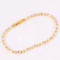Detailed close-up of a gold-plated bracelet featuring vibrant rectangular cubic zirconia - White Zirconia Bracelet