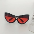 Oversized black cat eye sunglasses with translucent red lenses and heart cutout - Black Red