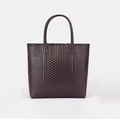 Deep brown hand-woven straw tote bag with sturdy round handles for summer vacation style - Small / Coffee Brown