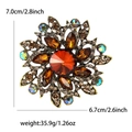Vintage flower brooch in amber crystal and alloy with rhinestones, 7.0cm sunburst design - Brown