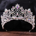 Close-up of baroque silver bridal tiara with colorful AB rhinestones on black fabric - Iridescent Silver AB Rhinestones