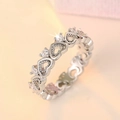 Elegant silver heart ring with sparkling zircons shown from a 45-degree angle - US 7 / White Gold