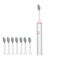 White sonic electric toothbrush with rose gold accents and eight replacement brush heads - 101 White (8 Heads)